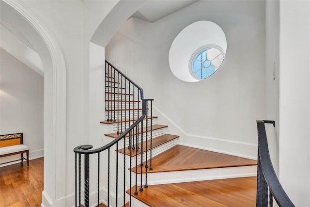 stairs featuring wood-type flooring