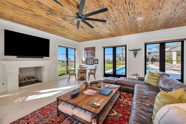 living room with ceiling fan, wood ceiling, french doors, and a wealth of natural light