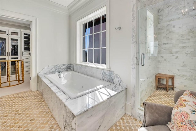 bathroom with ornamental molding and plus walk in shower