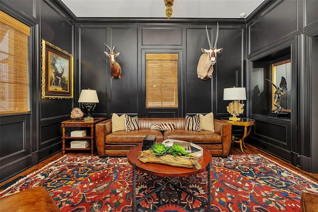 living area featuring ornamental molding