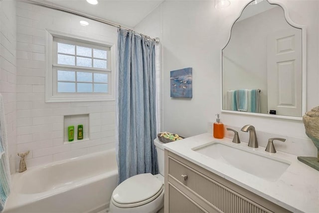 full bathroom featuring vanity, shower / tub combo, and toilet