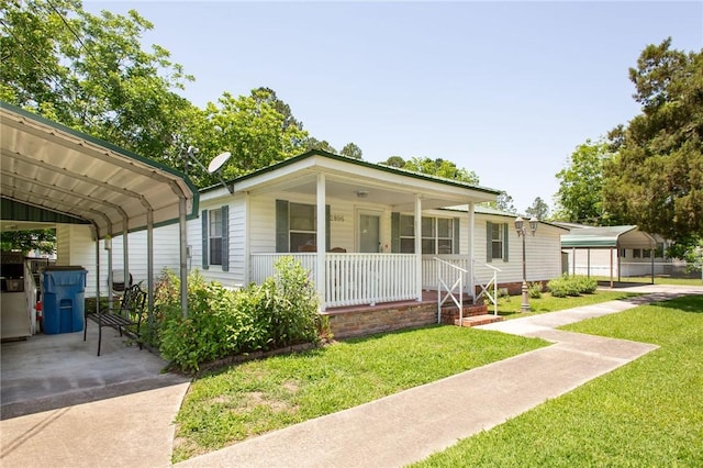2896 S Lakeview Dr, Waycross, GA 31503 - view of front of home with covered porch, a front yard, and a carport