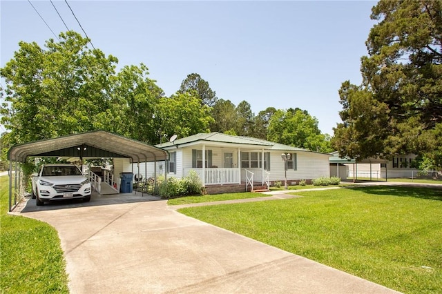 2896 S Lakeview Dr, Waycross, GA 31503 - view of front of house with driveway, a porch, a front yard, and a carport
