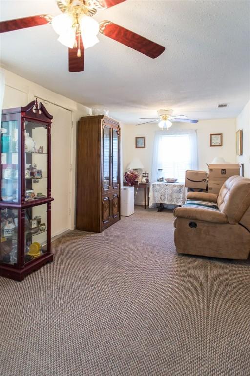 2896 S Lakeview Dr, Waycross, GA 31503 - carpeted living area featuring a ceiling fan