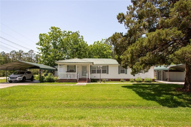 2896 S Lakeview Dr, Waycross, GA 31503 - view of front facade with a carport, covered porch, a front lawn, and metal roof