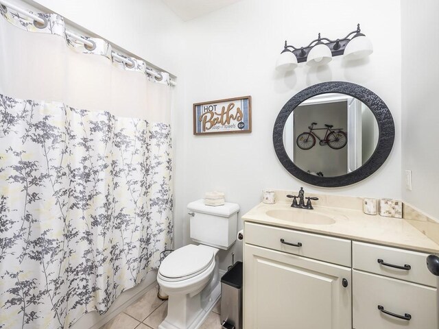 108 Fox Run Dr, Brunswick, GA 31525 - full bath with tile patterned floors, a shower with shower curtain, toilet, and vanity