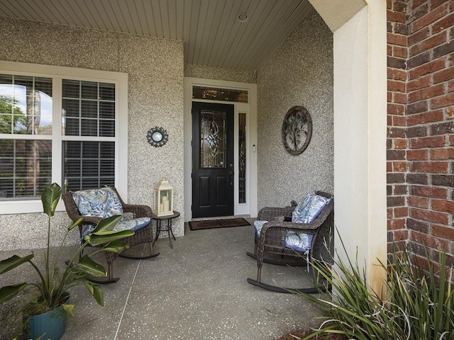108 Fox Run Dr, Brunswick, GA 31525 - property entrance featuring stucco siding, covered porch, and brick siding