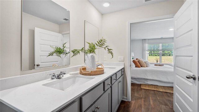 331 Elizabeth Dr, Brunswick, GA 31525 - full bath with wood finished floors, double vanity, and ensuite bathroom