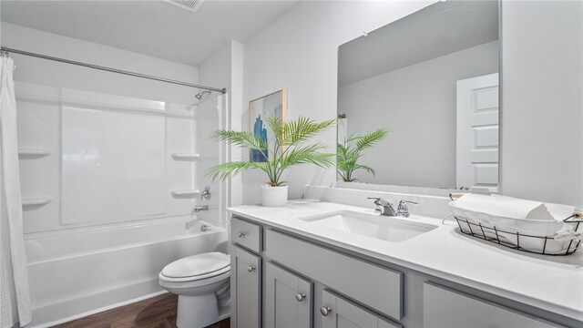 331 Elizabeth Dr, Brunswick, GA 31525 - full bath featuring wood finished floors, toilet, vanity, and shower / bath combination with curtain