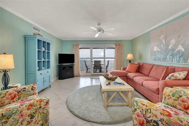 living room featuring a textured ceiling, ornamental molding, visible vents, and a ceiling fan