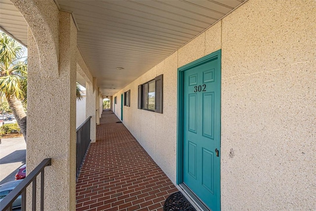 property entrance featuring stucco siding