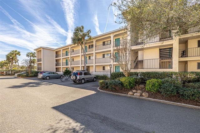 view of property featuring uncovered parking