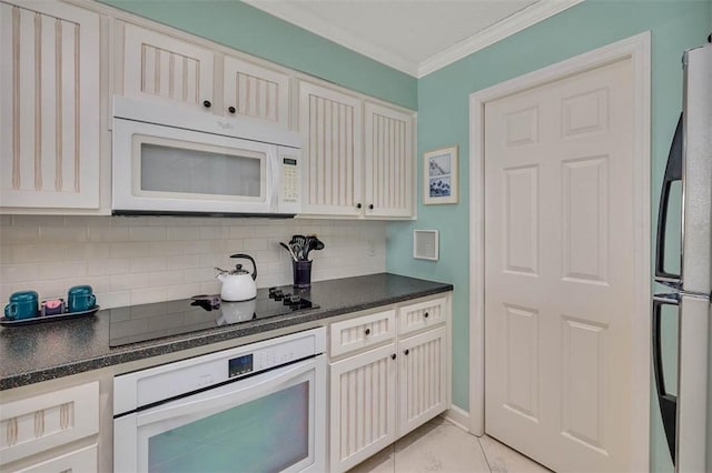 kitchen featuring light tile patterned floors, tasteful backsplash, dark countertops, ornamental molding, and white appliances