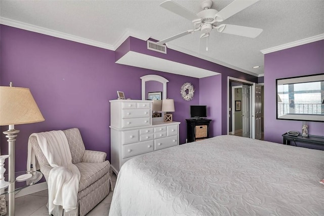 bedroom with a textured ceiling, a ceiling fan, visible vents, ornamental molding, and tile patterned floors