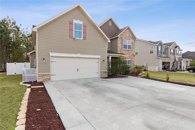 view of front facade with a garage and a front yard