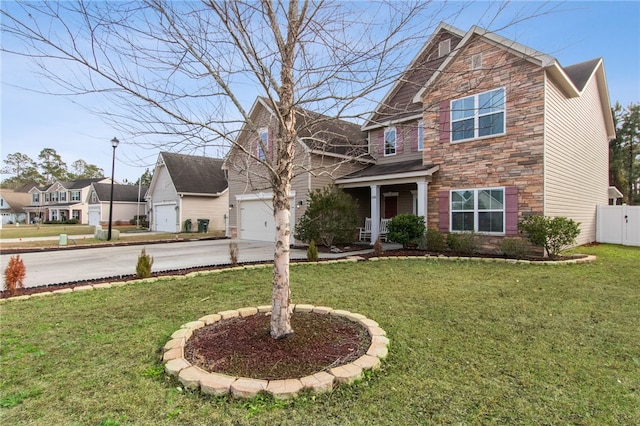 view of front of property featuring a garage and a front yard