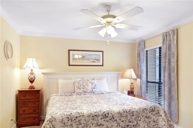 bedroom with ceiling fan and crown molding