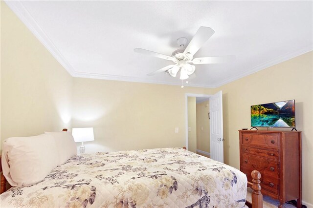 bedroom featuring carpet flooring, ceiling fan, and ornamental molding