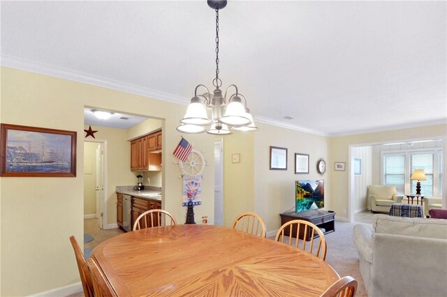 carpeted dining area featuring a notable chandelier and crown molding