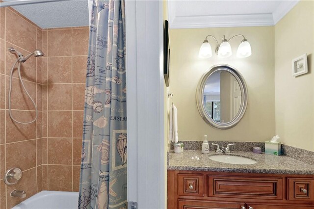 bathroom featuring vanity, shower / bathtub combination with curtain, and crown molding