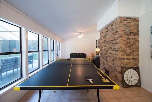 recreation room with tile patterned flooring and ceiling fan