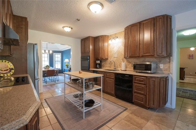 kitchen with black appliances, under cabinet range hood, a sink, backsplash, and light countertops