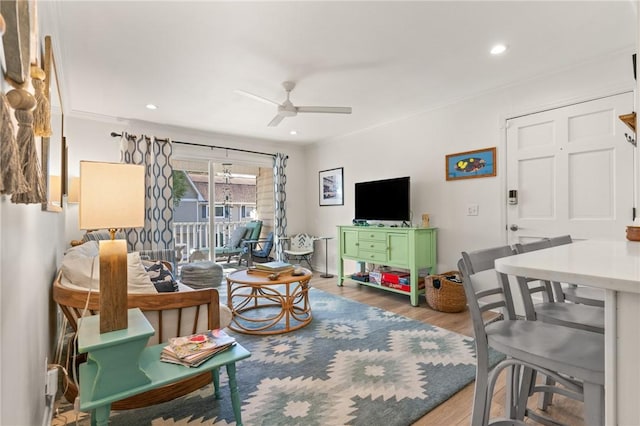 living room with a ceiling fan, wood finished floors, and recessed lighting