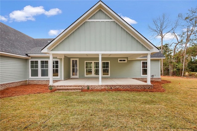 back of house featuring a yard and a patio