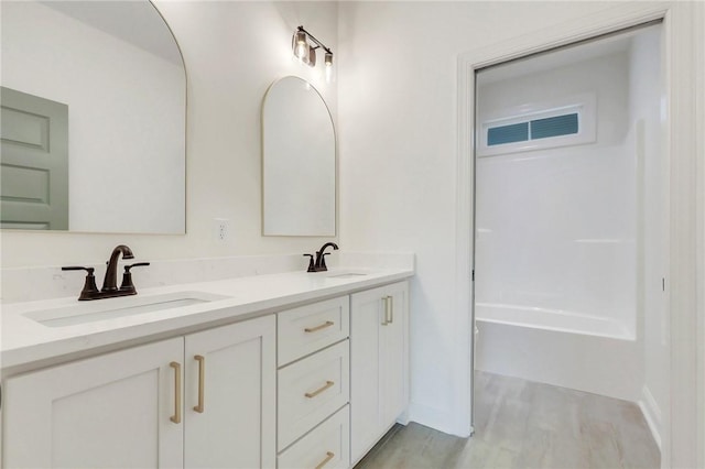 bathroom featuring hardwood / wood-style floors and vanity