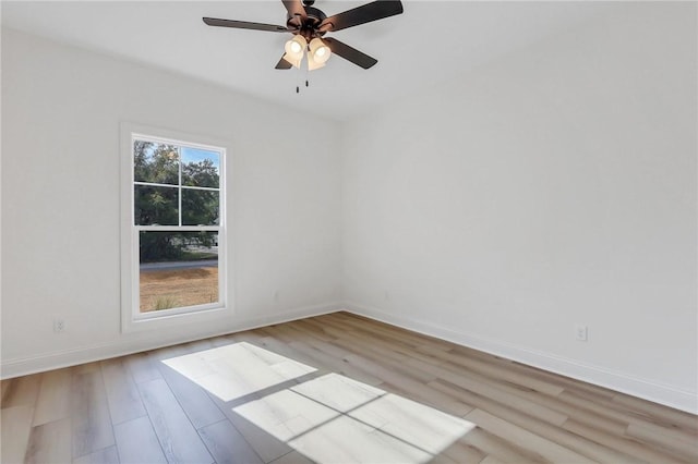 unfurnished room with ceiling fan and light wood-type flooring