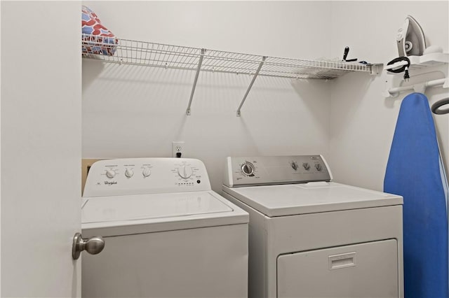 laundry area with separate washer and dryer