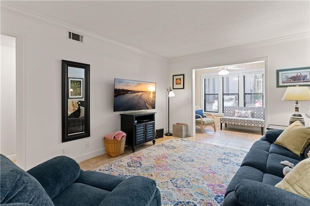 living room featuring ceiling fan, ornamental molding, and light tile patterned floors