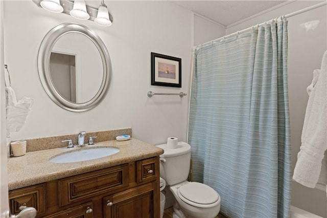 bathroom featuring vanity, toilet, and walk in shower