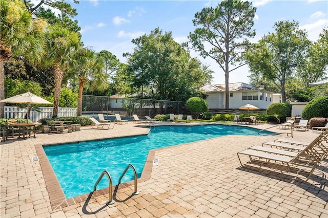 view of swimming pool featuring a patio