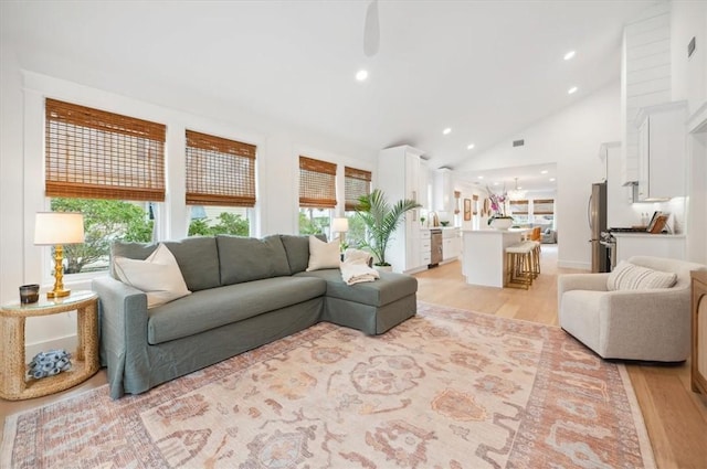 301 Kelsall Ave, Saint Simons Island, GA 31522 - living area featuring light wood-style flooring, recessed lighting, a ceiling fan, and high vaulted ceiling