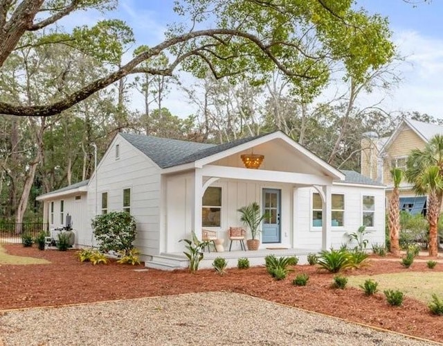 301 Kelsall Ave, Saint Simons Island, GA 31522 - ranch-style house featuring a porch, board and batten siding, and roof with shingles