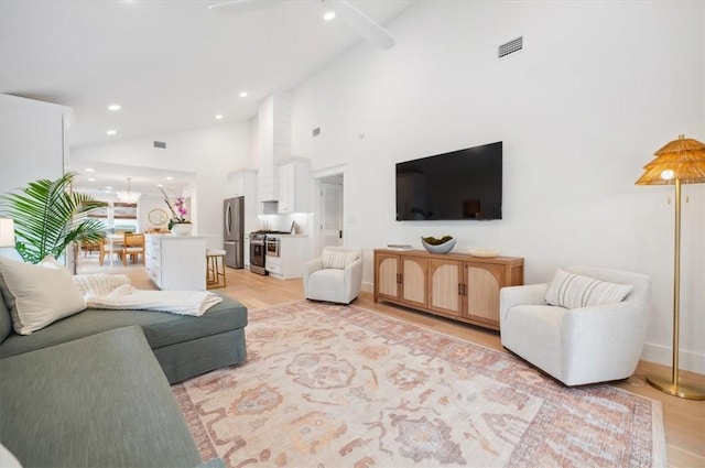 301 Kelsall Ave, Saint Simons Island, GA 31522 - living room with high vaulted ceiling, light wood-style flooring, recessed lighting, and ceiling fan