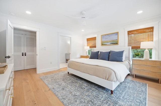 301 Kelsall Ave, Saint Simons Island, GA 31522 - bedroom with light wood-style floors, recessed lighting, ensuite bathroom, and ceiling fan