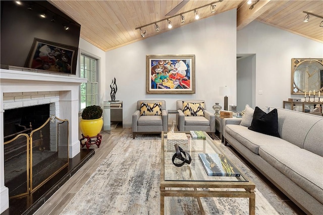 living room featuring hardwood / wood-style floors, a brick fireplace, wooden ceiling, and lofted ceiling