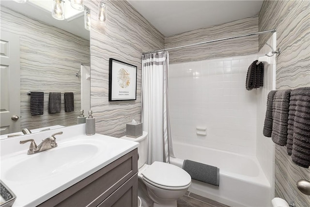 full bathroom featuring tile walls, vanity, shower / bath combo with shower curtain, and toilet