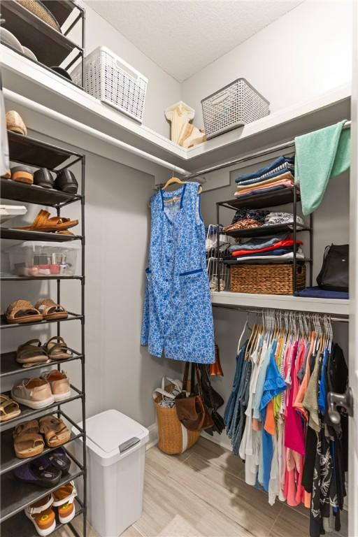 spacious closet with wood finished floors