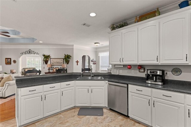 kitchen with visible vents, a peninsula, dishwasher, open floor plan, and plenty of natural light