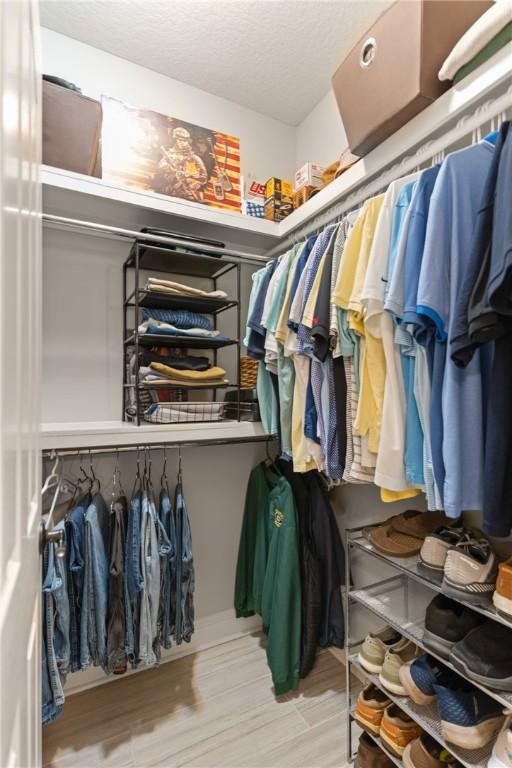 spacious closet featuring wood finished floors