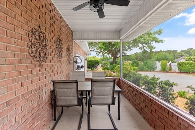 balcony with a ceiling fan and outdoor dining area