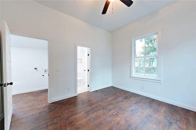 spare room featuring ceiling fan and dark hardwood / wood-style floors