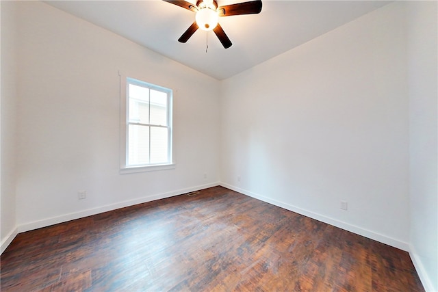 spare room featuring ceiling fan and dark hardwood / wood-style floors