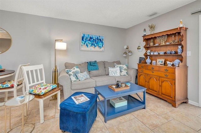 132 S Island Square Dr, Saint Simons Island, GA 31522 - living room with a textured ceiling and light tile patterned flooring