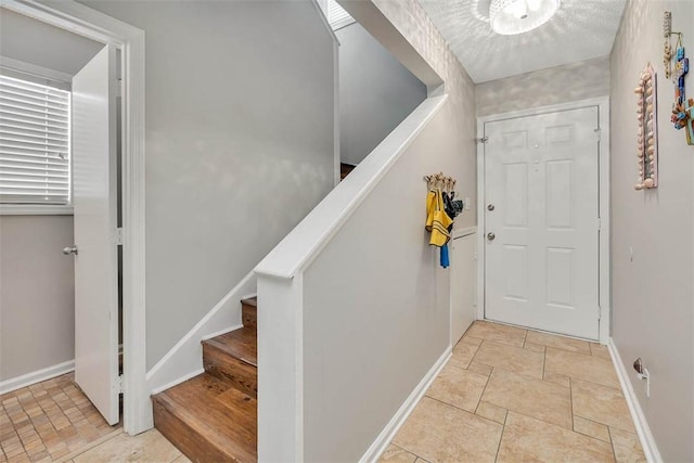 132 S Island Square Dr, Saint Simons Island, GA 31522 - entryway with stone finish floors and stairway