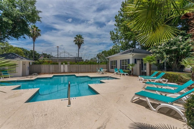 132 S Island Square Dr, Saint Simons Island, GA 31522 - community pool featuring a patio and an outbuilding