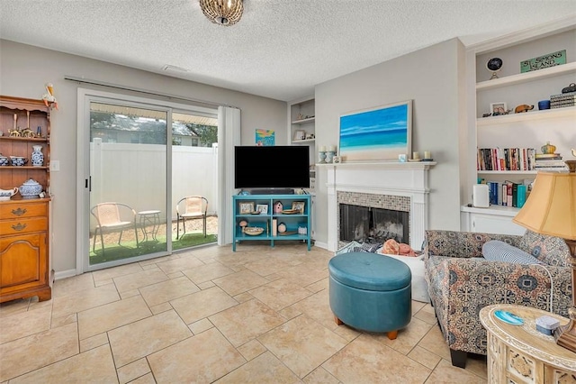 132 S Island Square Dr, Saint Simons Island, GA 31522 - living area with built in features, a fireplace, and a textured ceiling